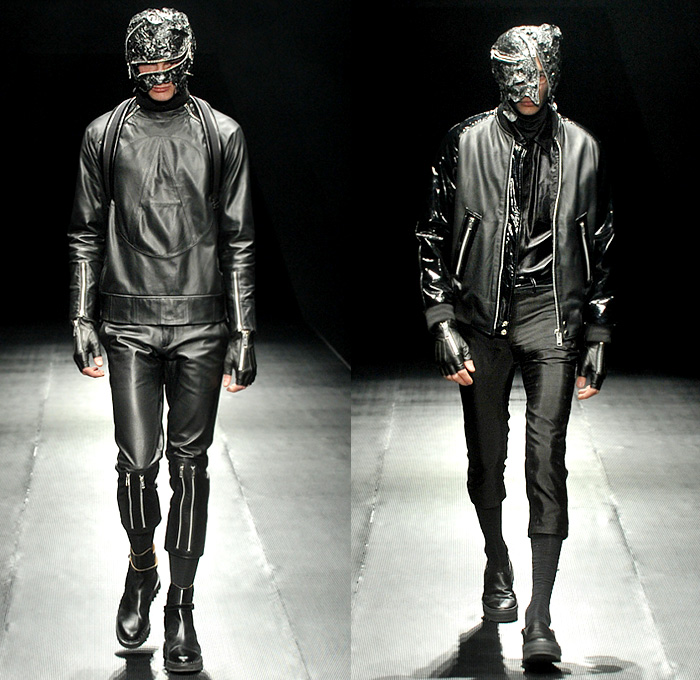 99%IS- by Bajowoo 2014-2015 Fall Autumn Winter Mens Runway Looks - Mercedes-Benz Fashion Week Tokyo Japan Catwalk Fashion Show - Black Apocalyptic Dark Shorts Zippers Leather Down Jacket Puffer Outerwear Trench Coat Motorcycle Biker Rider Cargo Pockets Cropped Gloves Mask Straps Crop Top Midriff Kilt Manskirt Jumpsuit Salopette Coveralls Dungarees Bib Brace Turtleneck Sweater Jumper Vest Waistcoat Trousers Pants Bomber Jacket Skinny Multi-Panel Metallic Studs Nautical