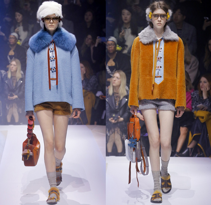 Anya Hindmarch 2017-2018 Fall Autumn Winter Womens Runway Catwalk Looks - London Fashion Week Collections UK United Kingdom - Old Norse Folklore Scandinavian Kurbits Wool Felt Outerwear Coat Poncho Cloak Cape Jacket Turtleneck Chunky Fairisle Knit Sweater Embellishments Adorned Decorated Bedazzled Hearts Dragonflies Leaves Combishorts Romper Onesie Playsuit Stack Collection Handmade Paper Chains Leather Straps Bag Mountain Smiley Slides Shearling Creepers Eyes Clogs Mules Sandals With Socks Sunglasses Shades Ear Muffs Hotpants Diaper Shorts Tote