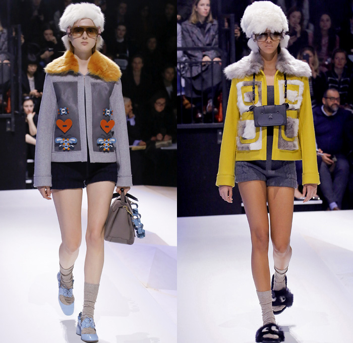 Anya Hindmarch 2017-2018 Fall Autumn Winter Womens Runway Catwalk Looks - London Fashion Week Collections UK United Kingdom - Old Norse Folklore Scandinavian Kurbits Wool Felt Outerwear Coat Poncho Cloak Cape Jacket Turtleneck Chunky Fairisle Knit Sweater Embellishments Adorned Decorated Bedazzled Hearts Dragonflies Leaves Combishorts Romper Onesie Playsuit Stack Collection Handmade Paper Chains Leather Straps Bag Mountain Smiley Slides Shearling Creepers Eyes Clogs Mules Sandals With Socks Sunglasses Shades Ear Muffs Hotpants Diaper Shorts Tote