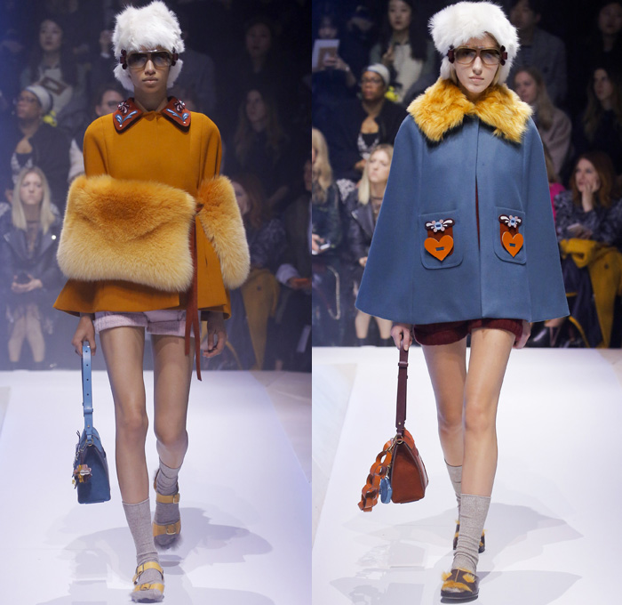 Anya Hindmarch 2017-2018 Fall Autumn Winter Womens Runway Catwalk Looks - London Fashion Week Collections UK United Kingdom - Old Norse Folklore Scandinavian Kurbits Wool Felt Outerwear Coat Poncho Cloak Cape Jacket Turtleneck Chunky Fairisle Knit Sweater Embellishments Adorned Decorated Bedazzled Hearts Dragonflies Leaves Combishorts Romper Onesie Playsuit Stack Collection Handmade Paper Chains Leather Straps Bag Mountain Smiley Slides Shearling Creepers Eyes Clogs Mules Sandals With Socks Sunglasses Shades Ear Muffs Hotpants Diaper Shorts Tote