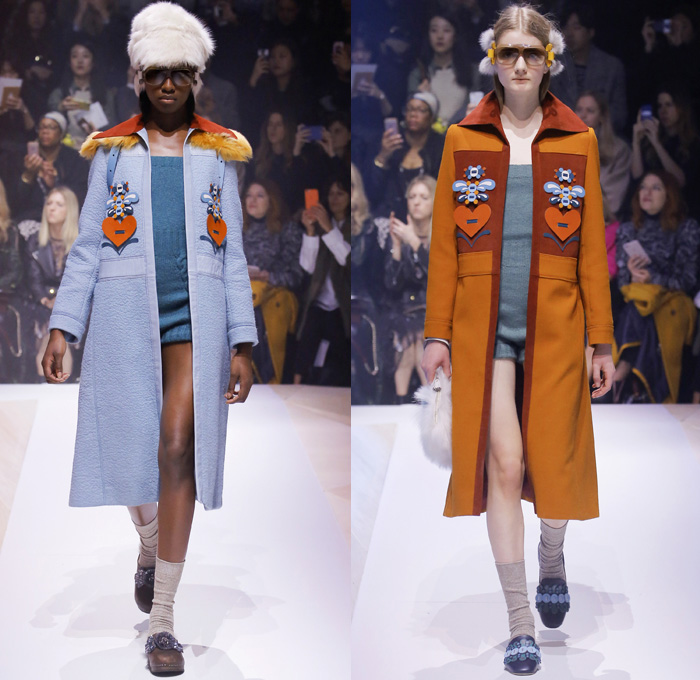 Anya Hindmarch 2017-2018 Fall Autumn Winter Womens Runway Catwalk Looks - London Fashion Week Collections UK United Kingdom - Old Norse Folklore Scandinavian Kurbits Wool Felt Outerwear Coat Poncho Cloak Cape Jacket Turtleneck Chunky Fairisle Knit Sweater Embellishments Adorned Decorated Bedazzled Hearts Dragonflies Leaves Combishorts Romper Onesie Playsuit Stack Collection Handmade Paper Chains Leather Straps Bag Mountain Smiley Slides Shearling Creepers Eyes Clogs Mules Sandals With Socks Sunglasses Shades Ear Muffs Hotpants Diaper Shorts Tote