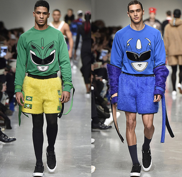 Bobby Abley 2017-2018 Fall Autumn Winter Mens Runway Catwalk Looks - London Collections Fashion Week Mens British Fashion Council UK United Kingdom - Power Rangers Dinosaurs Teddy Bear Pop Art Knit Sweater Jumper Furry Shaggy Shearling Mohair Shorts Over Leggings Straps Arm Warmers Sweatpants Jogger Colorblock Tracksuit Outerwear Coat Crop Top Midriff Leg Panels Poncho Cloak Trucker Jacket Harness Trainers Shoes Choker Helmet Tote Bag Denim Jeans