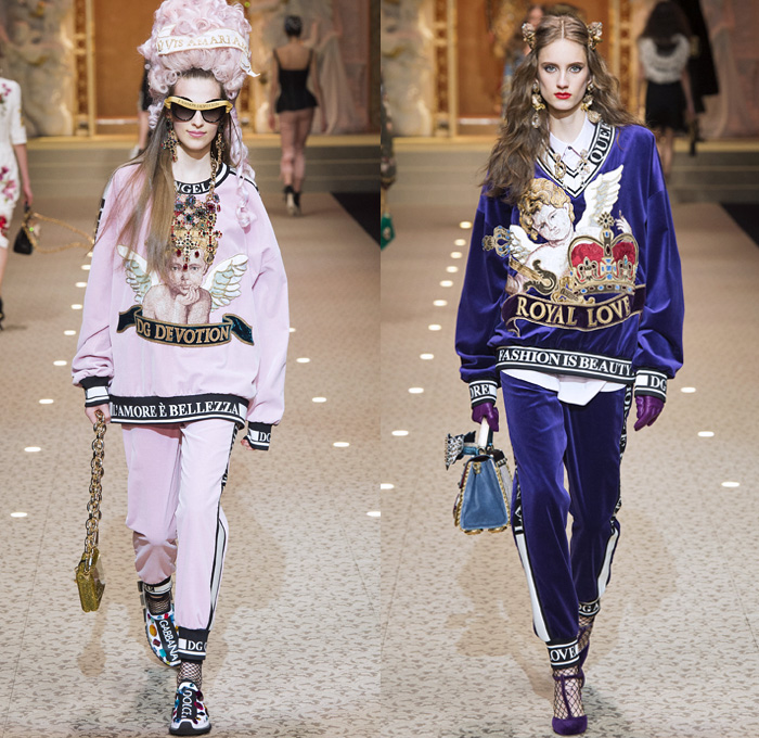 Dolce + Gabbana 2018-2019 Fall Autumn Winter Womens Runway Looks - Milan Fashion Week Italy - Leopard Zebra Embroidery Sequins Jewels Trinkets Ruffles Patches Pop Art Cherubs Religious Cross Feathers Cow Brocade Velvet Fringes Flowers Tulle Veil Brooch Lace Up Corset Tassels Houndstooth Tweed Hearts Pinstripe Fur Coat Pantsuit Robe Strapless Knit Cardigan Pussycat Bow Street Denim Jeans Tiered Stockings Jogger Wide Leg Dress Bag Chain Heels Tiara Beret Box Thurible Dinnerware Teddy Bear Boots