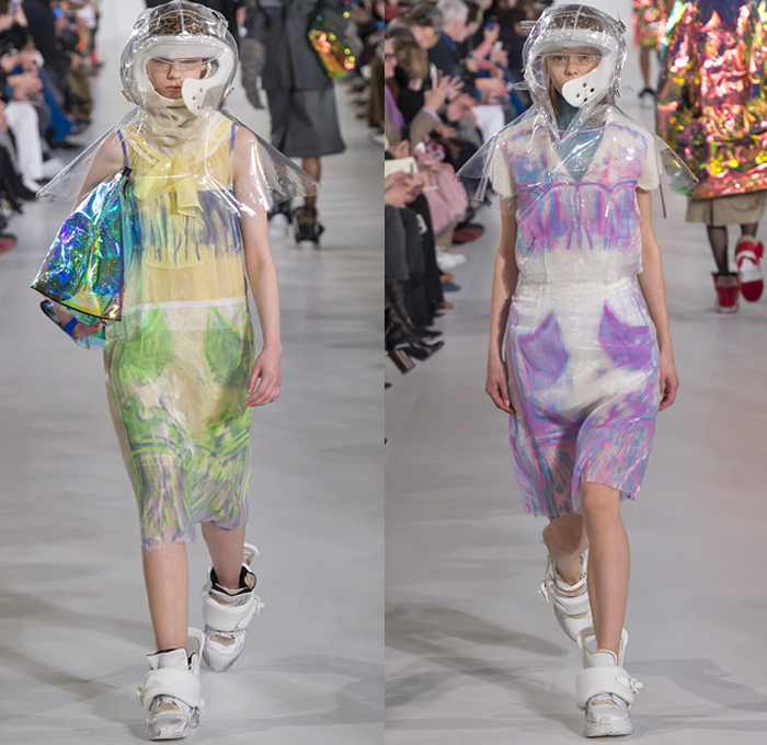 Maison Margiela 2018-2019 Fall Autumn Winter Womens Runway Catwalk Looks - Mode à Paris Fashion Week France - Post-Apocalyptic Techno Hi-Tech Fabrics Reflective Metallic Foil Layers Hazard Rainwear Plastic Hoodie Sheer Chiffon Mesh Fishnet Fringes Feathers Straps Hybrid Combo Plaid Check Wireframe Lace Ruffles Outerwear Coat Parka Jacket Knit Sweater Turtleneck Jumpsuit Coveralls Accordion Pleats Dress Skirt Stockings Handbag Quilted Tote Headwear Cap Gas Bee Mask  Snowboard Trainers Boots