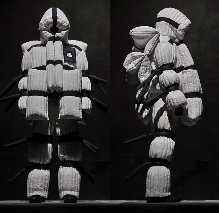 Moncler 5 Craig Green 2018-2019 Fall Autumn Winter Lookbook Presentation - Milano Moda Donna Collezione Milan Fashion Week Italy - Moncler Genius Project Arctic Alpine Black White Oversized Quilted Waffle Puffer Puffa Down Jacket Bubble Padded Parka Outerwear Coat Hoodie Cinch Straps Mountaineering Exoskeleton Beetle Pillow Comforter Antennae Samurai Warrior Tubes Stripes Ridges Inflatable Lifesaver Floatation Dimensional Sculptural Futuristic