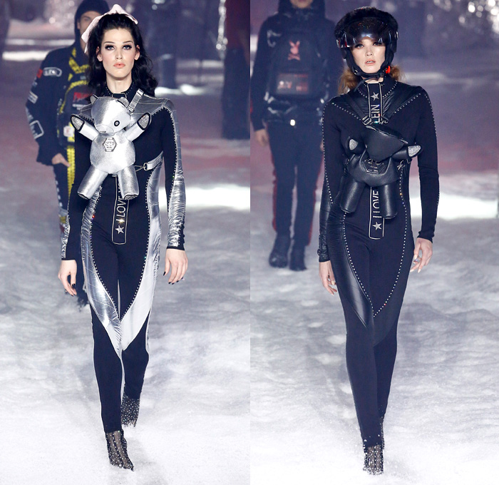 Philipp Plein 2018-2019 Fall Autumn Winter Womens Runway Catwalk Looks - New York Fashion Week NYFW - Space Invasion UFO Futuristic Sportswear Alpine Arctic Skis Snowboards Straps Belts Aviator Helmet Metallic Silver Nylon Thermal Harness Outerwear Parka Quilted Puffer Down Jacket Bubble Coat Hoodie Plush Fur Shearling Biker Pants Backpack Teddy Bear Mini Attache Snakeskin Goggles Ombré Plastic Rainwear Bedazzled Jewels Gemstones Studs Sequins Onesie Jumpsuit Sheer Tulle Tutu Unitard Robot