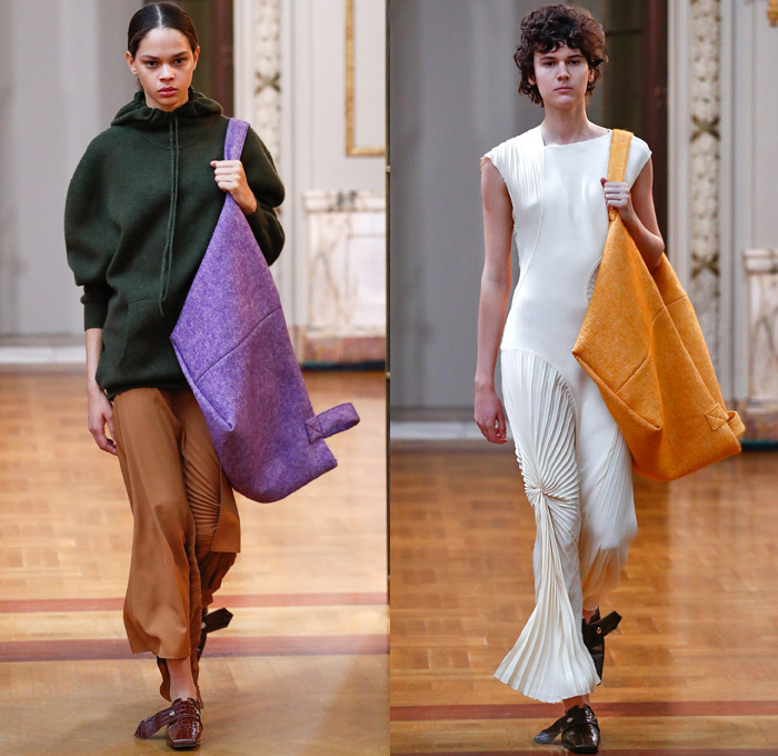 Victoria Beckham 2018-2019 Fall Autumn Winter Womens Runway Catwalk Looks - New York Fashion Week NYFW - Outerwear Overcoat Wool Hoodie Sweatshirt Leather Long Sleeve Blouse Shirt Vest Waistcoat Cargo Pockets Wide Band Belts Curved Hem Drawstring Tie Up Knot Accordion Pleats Jungle Leopard Abstract Animal Print Silk Satin Asymmetrical Hem Drapery Leggings Tights Skirt Maxi Dress Cropped Pants Duvet Shopper Powder Box Long Strap Square Toe Alligator Crocodile Leather Tote Handbag Shoes Footwear