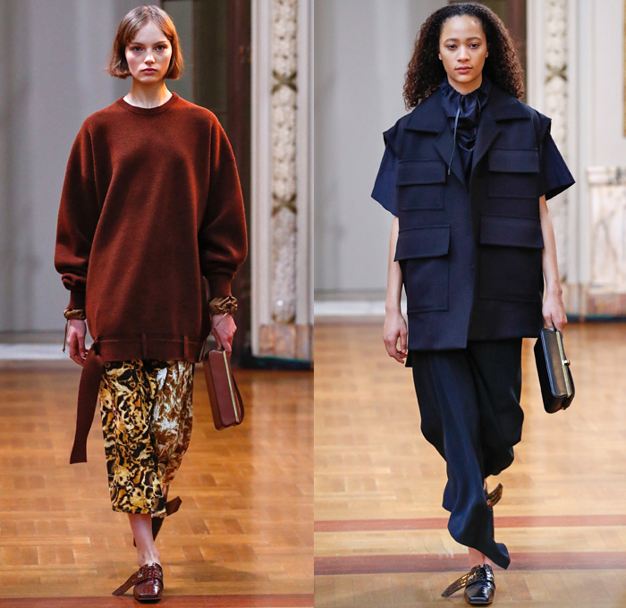 Victoria Beckham 2018-2019 Fall Autumn Winter Womens Runway Catwalk Looks - New York Fashion Week NYFW - Outerwear Overcoat Wool Hoodie Sweatshirt Leather Long Sleeve Blouse Shirt Vest Waistcoat Cargo Pockets Wide Band Belts Curved Hem Drawstring Tie Up Knot Accordion Pleats Jungle Leopard Abstract Animal Print Silk Satin Asymmetrical Hem Drapery Leggings Tights Skirt Maxi Dress Cropped Pants Duvet Shopper Powder Box Long Strap Square Toe Alligator Crocodile Leather Tote Handbag Shoes Footwear