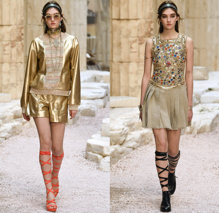 Chanel 2018 Resort Cruise Pre-Spring Womens Runway Catwalk Looks Collection Karl Lagerfeld - Ancient Greece Mediterranean Burlap Gold Coins Buttons Laurel Leaves Column Toga Dress Intarsia Stripes Knit Weave Tweed Mesh Ribbed Crochet Basketweave Sweater Jumper Fringes Sheer Chiffon Ornaments Decorative Art Bandeau Crop Top Pinafore Dress Outerwear Jacketdress Miniskirt Vest Tiered Pussycat Bow Ribbon Lace Embroidery Flowers Floral Bedazzled Jewels Jewels Sequins Pearls Wrap Tie Up Silk Satin Shorts Bodyplate Armor Strapless Accordion Pleats Halterneck Robe Goddess Gown Eveningwear Wind Swirls One Shoulder Gladiator Sandals Straps Bangles Choker Sunglasses Corset Drapery Handbag Purse Clutch Faded Denim Jeans 