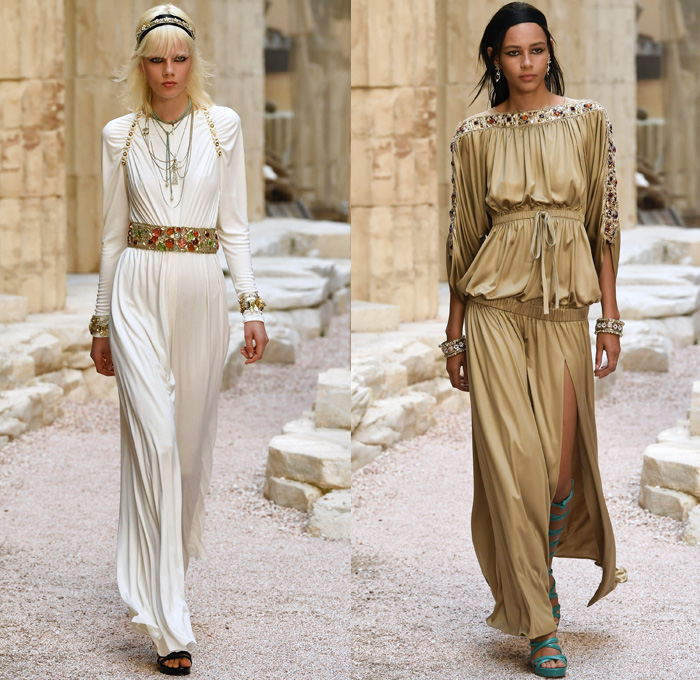 Chanel 2018 Resort Cruise Pre-Spring Womens Runway Catwalk Looks Collection Karl Lagerfeld - Ancient Greece Mediterranean Burlap Gold Coins Buttons Laurel Leaves Column Toga Dress Intarsia Stripes Knit Weave Tweed Mesh Ribbed Crochet Basketweave Sweater Jumper Fringes Sheer Chiffon Ornaments Decorative Art Bandeau Crop Top Pinafore Dress Outerwear Jacketdress Miniskirt Vest Tiered Pussycat Bow Ribbon Lace Embroidery Flowers Floral Bedazzled Jewels Jewels Sequins Pearls Wrap Tie Up Silk Satin Shorts Bodyplate Armor Strapless Accordion Pleats Halterneck Robe Goddess Gown Eveningwear Wind Swirls One Shoulder Gladiator Sandals Straps Bangles Choker Sunglasses Corset Drapery Handbag Purse Clutch Faded Denim Jeans 