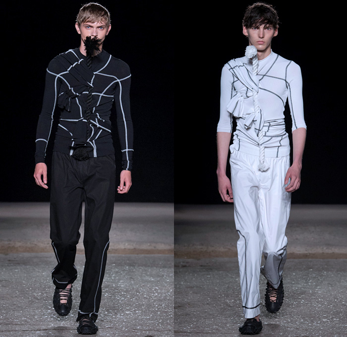 Craig Green 2018 Spring Summer Mens Runway Catwalk Looks - London Fashion Week Mens British Fashion Council UK United Kingdom - Altar Kite Skeletal Knit Weave Zigzag Stitch Tie Up Twist Rope Tassel Curtain Harness Drawstring Pin Accordion Pleats Fringes Diamonds Grid Lattice Sash Shawl Table Runner Scarf Chevron Art Landscape Sun Sea Sunburst Sunrays Birds Parrot Palm Trees Outerwear Coat Sleeveless Vest Sweater Crop Top Midriff Nylon Shirtdress Oversized Sweatshirt Hood Poncho Cloak Blanket Raw Dry Selvedge Denim Jeans Tank Top Perforated Hole Dark Wash Contrast Stitching Wide Leg Frayed Raw Hem Slouchy Pants Trousers Sandals Lace Up Sack Bag