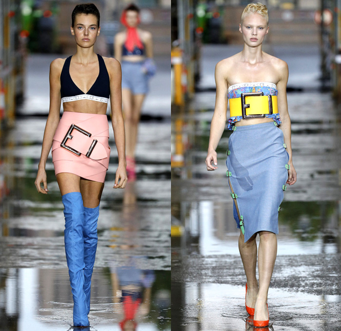 Marina Hoermanseder 2018 Spring Summer Womens Runway Catwalk Looks - Berlin Fashion Week Germany Deutschland Frühjahr Sommer 2018 - Matryoshka Russian Nesting Babushka Doll Mega Buckle Wide Belt Sculptural Straps Wrap Around Bustier Corset Strapless PVC Vinyl Pleather Bedazzled Metallic Studs Denim Jeans Sheer Chiffon Organza Tulle Turtleneck Sweater Jumper Shirt Crop Top Midriff Tiered Ruffles Flounce Flowers Floral Botanical Embroidery Belt Skirt Miniskirt Peplum Wide Leg Trousers Palazzo Pants Leotard Thigh High Boots Headscarf Tote Handbag