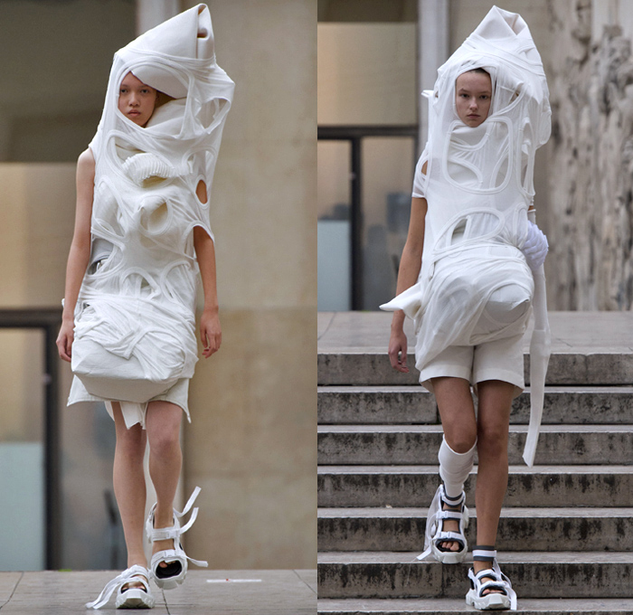 Rick Owens 2018 Spring Summer Womens Runway Catwalk Looks - Mode à Paris Fashion Week Mode Féminin France - Dirt Dimensional Structural Organic Shape Sculptural Futuristic Pillow Wrap Cocoon Stuffed Outerwear Coat Blazerdress Hanging Sleeve Cape Shawl Blanket Holes Wrap Drapery Leather Peel Away Angular Pointed Tie Up Metallic Sheen Strapless Dress Gown Blouse Skirt Pleats Sleeveless One Shoulder Duffeldress Shorts Sneakers Sandals Warmers Asymmetrical Fanny Pack Waist Pouch Belt Bag