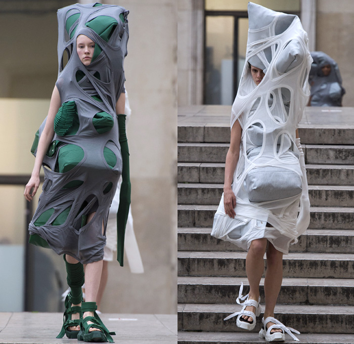 Rick Owens 2018 Spring Summer Womens Runway Catwalk Looks - Mode à Paris Fashion Week Mode Féminin France - Dirt Dimensional Structural Organic Shape Sculptural Futuristic Pillow Wrap Cocoon Stuffed Outerwear Coat Blazerdress Hanging Sleeve Cape Shawl Blanket Holes Wrap Drapery Leather Peel Away Angular Pointed Tie Up Metallic Sheen Strapless Dress Gown Blouse Skirt Pleats Sleeveless One Shoulder Duffeldress Shorts Sneakers Sandals Warmers Asymmetrical Fanny Pack Waist Pouch Belt Bag