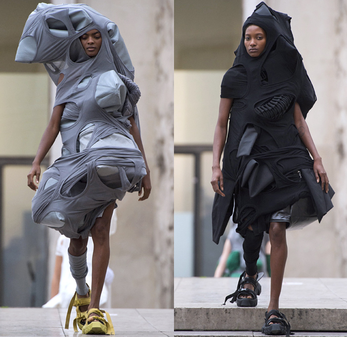 Rick Owens 2018 Spring Summer Womens Runway Catwalk Looks - Mode à Paris Fashion Week Mode Féminin France - Dirt Dimensional Structural Organic Shape Sculptural Futuristic Pillow Wrap Cocoon Stuffed Outerwear Coat Blazerdress Hanging Sleeve Cape Shawl Blanket Holes Wrap Drapery Leather Peel Away Angular Pointed Tie Up Metallic Sheen Strapless Dress Gown Blouse Skirt Pleats Sleeveless One Shoulder Duffeldress Shorts Sneakers Sandals Warmers Asymmetrical Fanny Pack Waist Pouch Belt Bag