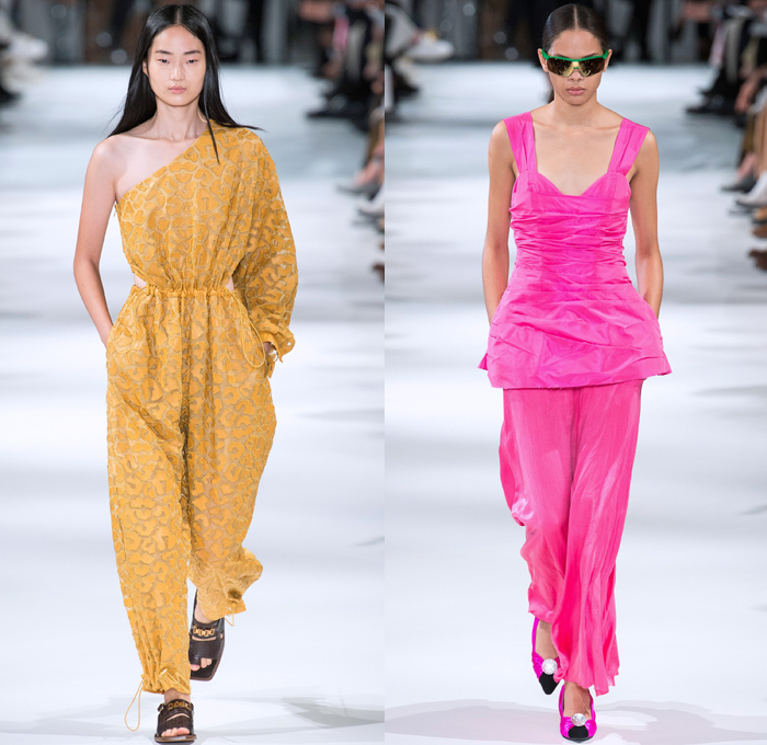 Stella McCartney 2018 Spring Summer Womens Runway Catwalk Looks - Mode à Paris Fashion Week France - Oversized Denim Jeans Cargo Pockets Tapered Colored Dyed Vest Onesie Jumpsuit Coveralls Boiler Suit Electric Fan Satin Geometric Fins Ruffles Pleather PVC Vinyl Sheer Chiffon Organza Tulle Leopard Fringes Microphone Fan Pop Art Motif Blouse Leg O'Mutton Sleeves One Shoulder Strapless Tie Up Waist Knot Shirtdress Cutout Waist Culottes Maxi Dress Sunglasses Boots Sandals Clutch Purse Handbag 