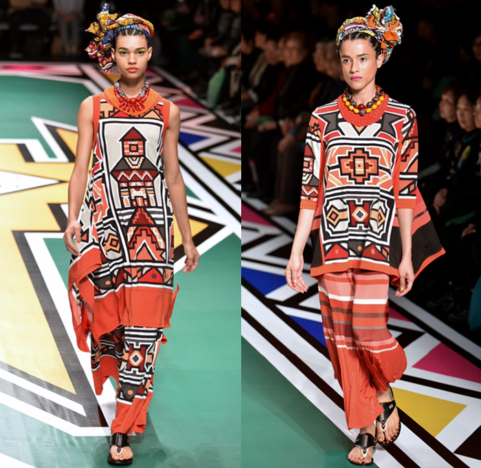 Tokuko 1er Vol by Tokuko Maeda 2018 Spring Summer Womens Runway Catwalk Looks - Amazon Fashion Week Tokyo Japan AmazonFWT - Cloak Blanket Shawl Turtleneck Embroidery Ornamental Print Decorative Art Tribal Ethnic Folk Geometric Church Building Ocean Illustration Faces Mesh Fishnet Accordion Pleats Flowers Floral Leaves Foliage Plants Sheer Tulle Perforated Lasercut Lace Animals Jungle Safari LED Lights Lantern Dress Tiered Wide Leg Headwear Turban Earrings Sandals Bangles Necklace Beads