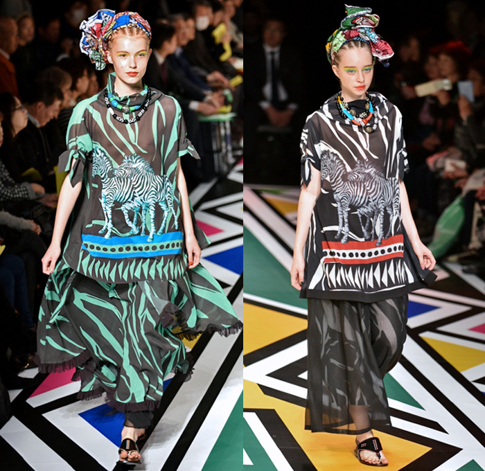 Tokuko 1er Vol by Tokuko Maeda 2018 Spring Summer Womens Runway Catwalk Looks - Amazon Fashion Week Tokyo Japan AmazonFWT - Cloak Blanket Shawl Turtleneck Embroidery Ornamental Print Decorative Art Tribal Ethnic Folk Geometric Church Building Ocean Illustration Faces Mesh Fishnet Accordion Pleats Flowers Floral Leaves Foliage Plants Sheer Tulle Perforated Lasercut Lace Animals Jungle Safari LED Lights Lantern Dress Tiered Wide Leg Headwear Turban Earrings Sandals Bangles Necklace Beads