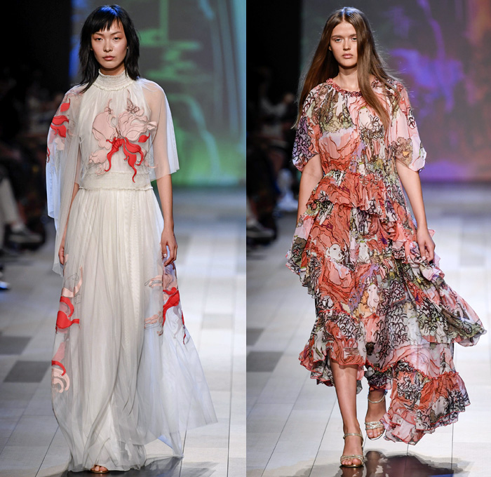 Vivienne Tam 2018 Spring Summer Womens Runway Catwalk Looks - New York Fashion Week NYFW - Wuba Monster Hunt Insects Animals Swans Rocks Trench Coat Denim Jeans Frayed Graffiti Cutout Shoulders Cargo Pockets Patchwork Fanny Pack Waist Pouch Handkerchief Hem Sheer Chiffon Tulle Bedazzled Grosgrain Strap Belt Stripes Rope Waist Lace Tribal Shirtdress Goddess Georgette Gown Tiered Dovetail Mullet Skirt Blouse Peasant Dress Strapless Braid Bracelets Scarf Tote Handbag Bamboo Basketweave