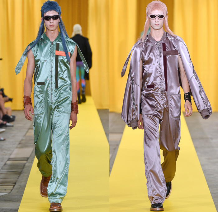 Walter Van Beirendonck 2018 Spring Summer Mens Runway Catwalk Looks - Mode à Paris Fashion Week Mode Masculine France - Owls Whisper Mullet Wig Fake Abs Pecs Geometric Face Long Sleeve Shirt Detachable Collar Metallic Silver Sheen Plaid Tartan Check Windowpane Hybrid Combo Panels Mix Match Mash Up Cutout Shoulders Suit Blazer Bomber Jacket Outerwear Coat Hanging Sleeve Hooded Parka Boxy Anorak Windbreaker Elongated Sleeves Shortall Combishorts Romper Onesie Coveralls Jumpsuit Slouchy Relaxed Pants Trousers Shorts Printed Socks Oxfords Tights Printed Leggings Leather Boots Bracelet Cuffs Sunglasses