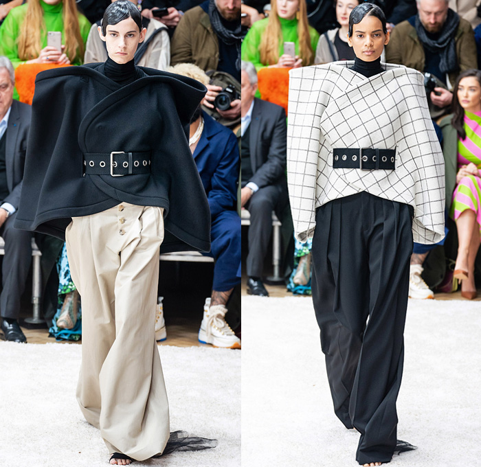 JW Anderson 2019-2020 Fall Autumn Winter Womens Runway Catwalk Looks - London Fashion Week Collections UK - Action Figure Doll Hair Oversized Wide Neckline Slouchy Sleeves Trench Coat Check Plaid Stripes Dots Sheer Tulle Cape Poncho Tie Up Waist Patchwork Blazer Pantsuit Lace Needlework Embroidery Houndstooth Tweed Paisley Knit Turtleneck Sweaterdress Hanging Sleeve Wide Leg Pants Belt Ruffles Bedazzled Silk Satin Dress Draped Fringes Gown Chain Equestrian Hat Bag Boots