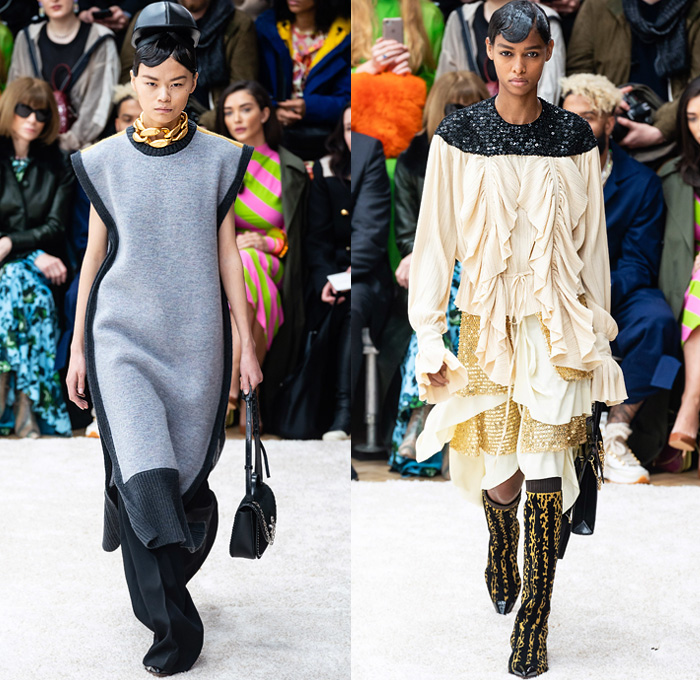 JW Anderson 2019-2020 Fall Autumn Winter Womens Runway Catwalk Looks - London Fashion Week Collections UK - Action Figure Doll Hair Oversized Wide Neckline Slouchy Sleeves Trench Coat Check Plaid Stripes Dots Sheer Tulle Cape Poncho Tie Up Waist Patchwork Blazer Pantsuit Lace Needlework Embroidery Houndstooth Tweed Paisley Knit Turtleneck Sweaterdress Hanging Sleeve Wide Leg Pants Belt Ruffles Bedazzled Silk Satin Dress Draped Fringes Gown Chain Equestrian Hat Bag Boots
