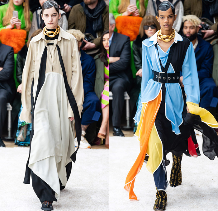 JW Anderson 2019-2020 Fall Autumn Winter Womens Runway Catwalk Looks - London Fashion Week Collections UK - Action Figure Doll Hair Oversized Wide Neckline Slouchy Sleeves Trench Coat Check Plaid Stripes Dots Sheer Tulle Cape Poncho Tie Up Waist Patchwork Blazer Pantsuit Lace Needlework Embroidery Houndstooth Tweed Paisley Knit Turtleneck Sweaterdress Hanging Sleeve Wide Leg Pants Belt Ruffles Bedazzled Silk Satin Dress Draped Fringes Gown Chain Equestrian Hat Bag Boots