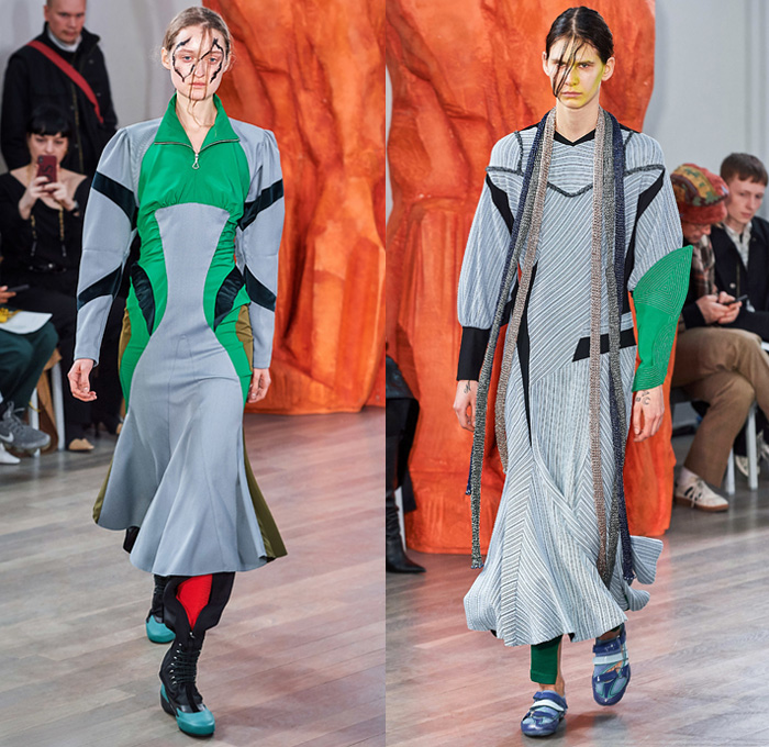 Kiko Kostadinov 2019-2020 Fall Autumn Winter Womens Runway Catwalk Looks - London Fashion Week Collections UK - Troll Doll Hair Knitwear Fringes Bib Turtleneck Gauntlet Arm Sleeve Poufy Shoulders Holes Dress Coat Velvet Knee Panels Stripes Skirt Grapes Scarf Cinch Draped Corduroy Angular Hem Nylon Asics Camper Drawstring Boots