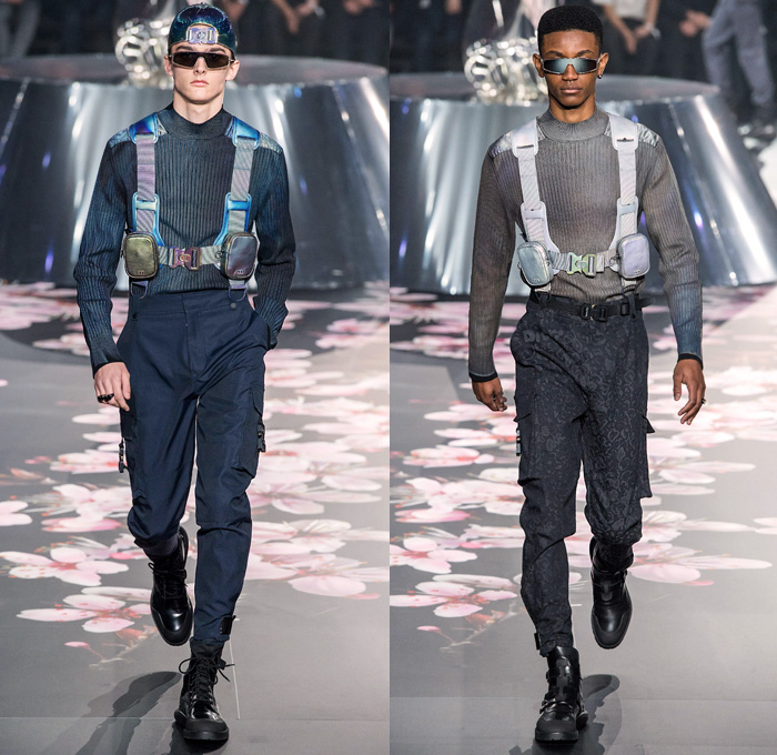 Christian Dior Homme 2019 Pre-Fall Autumn Mens Runway Looks Collection Kim Jones Tokyo Japan - Hajime Sorayama Japanese Art Illustrator Femmebot Robot Dinosaur Print Harness Bum Bag Satchel Backpack Straps Sunglasses Metallic Sheen Ribbed Turtleneck Knit Sweater Cargo Pants Utility Pockets Leopard Logo Monogram Sheer Chiffon Tulle Embroidery Bomber Jacket Plush Fur Anorak Outerwear Quilted Puffer Coat Kimono Cap One Button Suit Blazer Military Boots