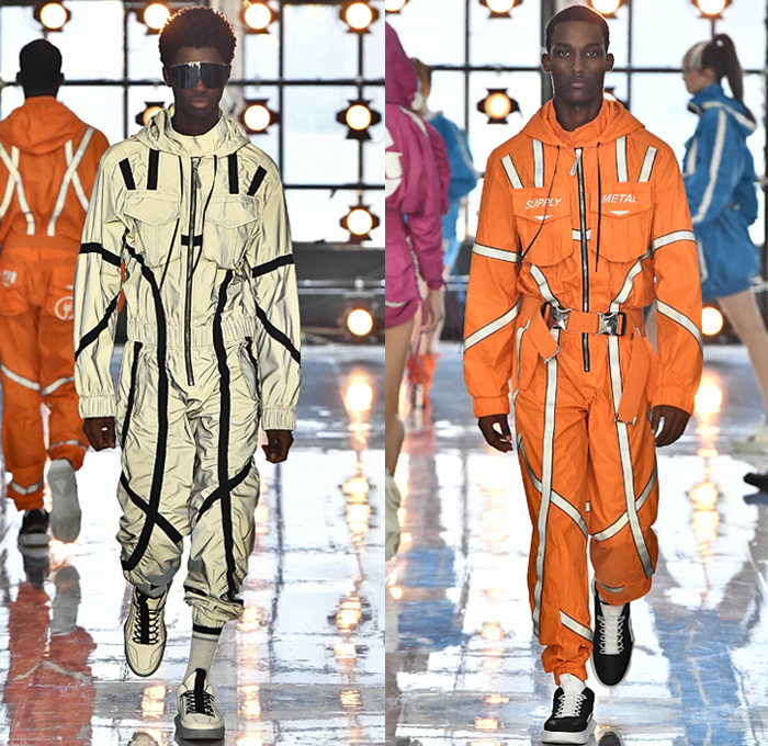 Byblos 2019 Spring Summer Mens Runway Catwalk Looks Collection - Milano Moda Donna Collezione Milan Fashion Week Italy - Burning Man Festival Recycling Destroyed Denim Jeans Metallic Silver Foil Bomber Jacket Feathers Sunglasses Cargo Pockets Shorts Backpack Parachute Pants Nylon Onesie Jumpsuit Coveralls Paratrooper