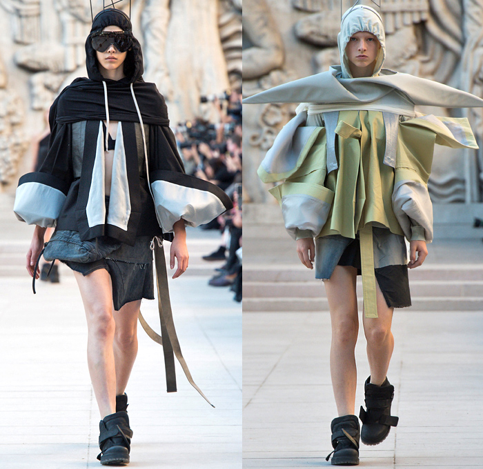 Rick Owens 2019 Spring Summer Womens Runway Catwalk Looks Collection - Mode à Paris Fashion Week France - Babel Tatlin Tower Post-Apocalyptic Deconstructed Wireframe Sculpture Organic Shape Dimensional Geometric Holes Mesh Cutout Oversized Folds Wide Sleeves Hoodie Sweatshirt Denim Jeans Skirt Fins Straps Crop Top Draped Fringes One Shoulder Maxi Dress Cape Fanny Pack Waist Pouch Bum Bag Jet Fighter Pilot Sunglasses Boots Torch