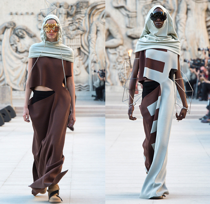 Rick Owens 2019 Spring Summer Womens Runway Catwalk Looks Collection - Mode à Paris Fashion Week France - Babel Tatlin Tower Post-Apocalyptic Deconstructed Wireframe Sculpture Organic Shape Dimensional Geometric Holes Mesh Cutout Oversized Folds Wide Sleeves Hoodie Sweatshirt Denim Jeans Skirt Fins Straps Crop Top Draped Fringes One Shoulder Maxi Dress Cape Fanny Pack Waist Pouch Bum Bag Jet Fighter Pilot Sunglasses Boots Torch