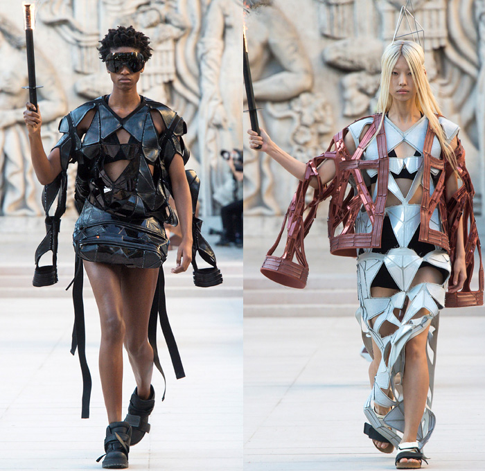 Rick Owens 2019 Spring Summer Womens Runway Catwalk Looks Collection - Mode à Paris Fashion Week France - Babel Tatlin Tower Post-Apocalyptic Deconstructed Wireframe Sculpture Organic Shape Dimensional Geometric Holes Mesh Cutout Oversized Folds Wide Sleeves Hoodie Sweatshirt Denim Jeans Skirt Fins Straps Crop Top Draped Fringes One Shoulder Maxi Dress Cape Fanny Pack Waist Pouch Bum Bag Jet Fighter Pilot Sunglasses Boots Torch