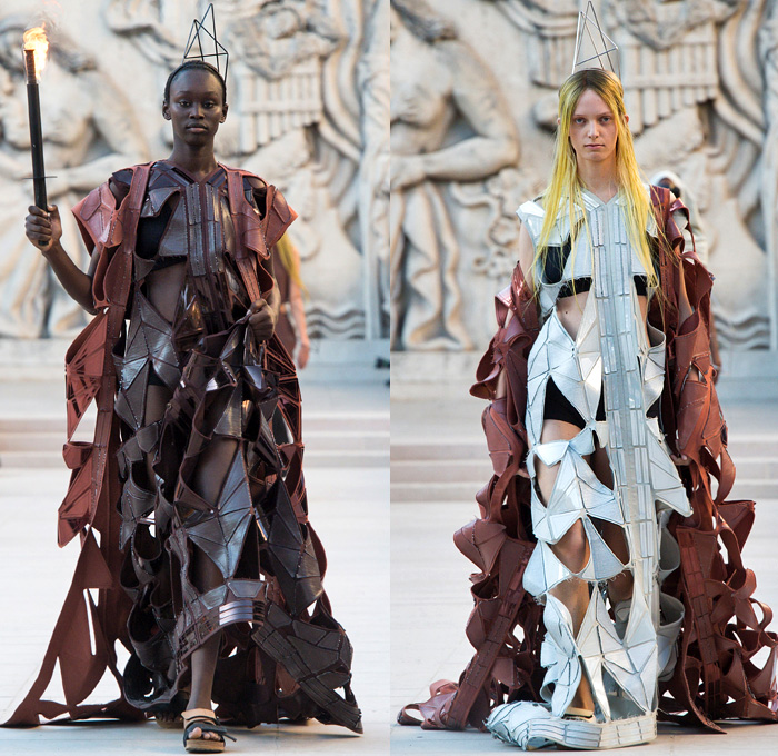 Rick Owens 2019 Spring Summer Womens Runway Catwalk Looks Collection - Mode à Paris Fashion Week France - Babel Tatlin Tower Post-Apocalyptic Deconstructed Wireframe Sculpture Organic Shape Dimensional Geometric Holes Mesh Cutout Oversized Folds Wide Sleeves Hoodie Sweatshirt Denim Jeans Skirt Fins Straps Crop Top Draped Fringes One Shoulder Maxi Dress Cape Fanny Pack Waist Pouch Bum Bag Jet Fighter Pilot Sunglasses Boots Torch