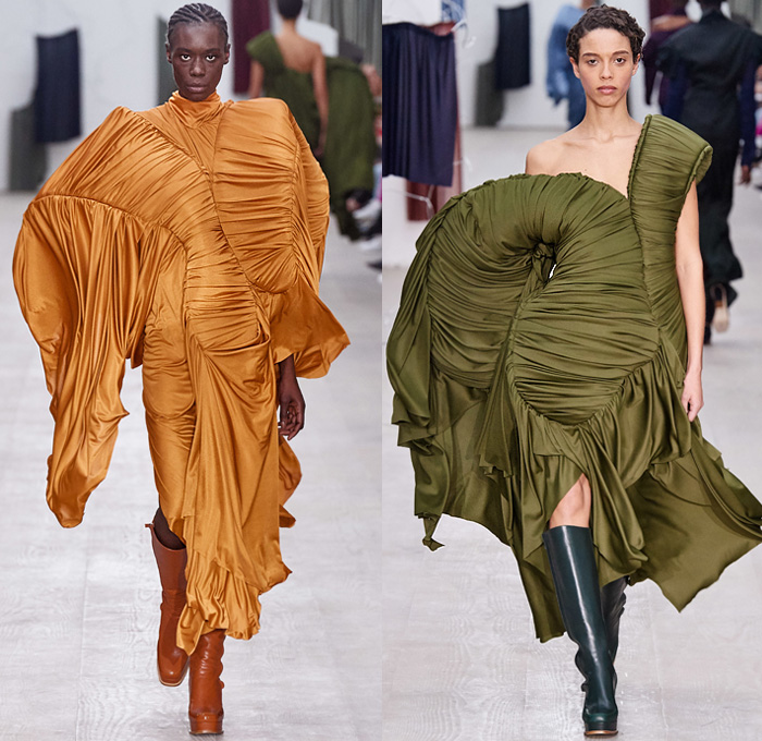 Richard Malone 2020-2021 Fall Autumn Winter Womens Runway Catwalk Looks - London Fashion Week Collections UK - Cinch Sheer Chiffon Organza Dress Harness Straps Tied Tool Belt Cargo Utility Flap Pockets Turtleneck Knit Cutout Sweater One Shoulder Strapless Wrap Pantsuit Jacket Blazer Long Skirt Flare Pants Patchwork Satchel Leather Coat Plush Fur Tabard Zipper Poufy Shoulders Silk Satin Accordion Pleats Sculptural Curved Gown Draped Beret Boots