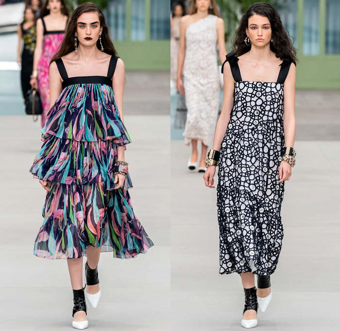 Chanel 2020 Resort Cruise Pre-Spring Womens Runway Catwalk Looks Collection Paris Grand Palais - Mom Chic Clocks Tweed Jacket Trench Coat Giant Bow Chain Knit Cardigan Cargo Pockets Cap Sleeve Bib Leather Bedazzled Beads Lace Embroidery Plaid Check Trompe L'oeil Flowers Floral Miniskirt Motorcycle Biker Vest Tabard Gloves Jumpsuit Coveralls Logo Mania Cuffs Tiered Ruffles Sheer Chiffon Halterneck Wide Leg Low Crotch Cropped Palazzo Sailor Pants Shorts Quilted Fanny Pack Bum Bag