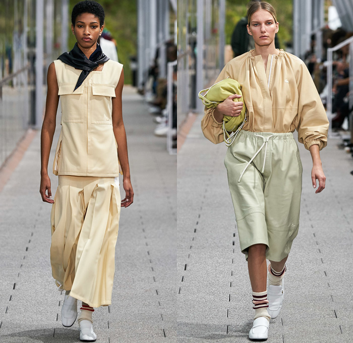 Lacoste 2020 Spring Summer Womens Runway Catwalk Looks Collection - Mode à Paris Fashion Week France - Tennis Court Stripes Slouchy Sporty Neck Scarf Sleeveless Blouse Paper Bag Waist Drawstring Wide Leg Culottes Color Block Knit Mesh Sweater Check Polo Shirt Accordion Pleats Skirt Track Pants Zipper Shirtdress Onesie Cargo Pockets Parkadress Anorakdress Tearaway Snap Buttons Diamond Shape Trench Coat Polished Leather Handbag Tote Loafers Sneakers