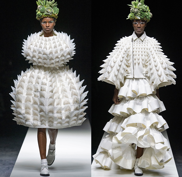 Noir Kei Ninomiya 2020 Spring Summer Womens Runway Catwalk Looks Collection - Mode à Paris Fashion Week France - Sculpture Cocoon Clouds Sheer Tulle Ruffles Tiered Furry Spikes Broccoli Grass Headwear Coral Mask Trompe L'oeil Lace Embroidery Needlework Flowers Floral Leaves Foliage Harness Straps Belts Pussycat Bow Ribbons Fringes Loops Mesh Shrub Perforated Racing Check Poufy Shoulders Pinafore Dress  Pins Needles Chandelier Gown Hoodie Trench Coat Motorcycle Biker Leather Jacket 