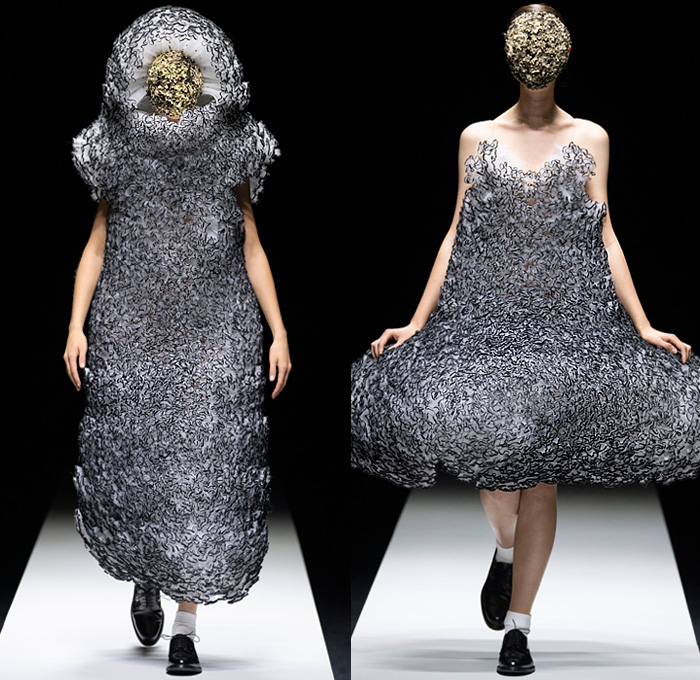 Noir Kei Ninomiya 2020 Spring Summer Womens Runway Catwalk Looks Collection - Mode à Paris Fashion Week France - Sculpture Cocoon Clouds Sheer Tulle Ruffles Tiered Furry Spikes Broccoli Grass Headwear Coral Mask Trompe L'oeil Lace Embroidery Needlework Flowers Floral Leaves Foliage Harness Straps Belts Pussycat Bow Ribbons Fringes Loops Mesh Shrub Perforated Racing Check Poufy Shoulders Pinafore Dress  Pins Needles Chandelier Gown Hoodie Trench Coat Motorcycle Biker Leather Jacket 