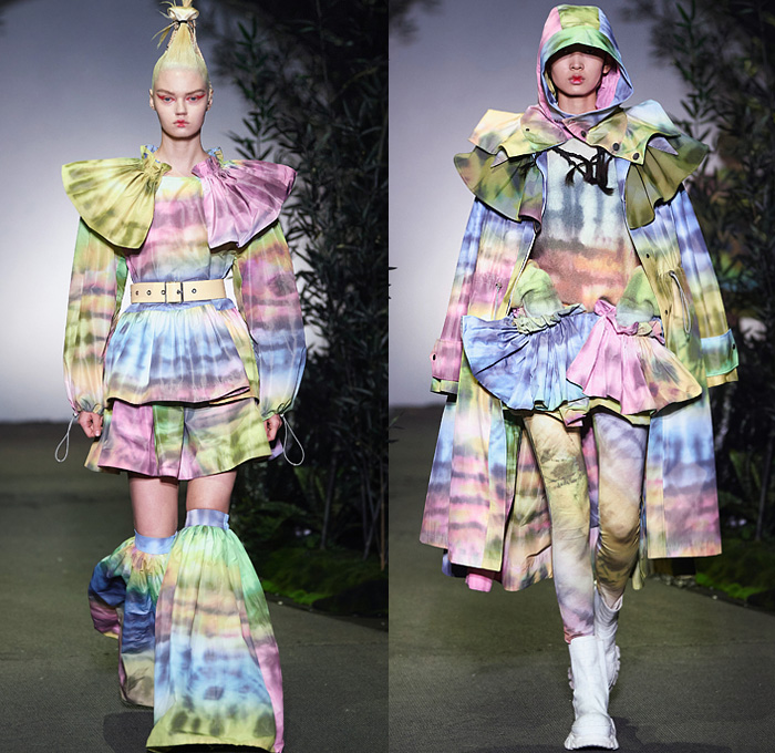 Angel Chen 2021-2022 Fall Autumn Winter Womens Runway Looks Collection - Anna May Wong Daughter of the Dragon - Strapless Blouse Acid Wash Tie-Dye Abstract Quilted Puffer Shawl Coat Parka Sweatshirt Shaggy Fur Ruffled Fold Over Roll Up Collar Funnelneck Anorak Slouchy Printed Denim Jeans Knit Crochet Flowers Floral Embroidery Sweater Pompoms Headwear Hat Pockets Puritan Collar Miniskirt Accordion Pleats Leggings Tights Shorts Tote Bag Boots