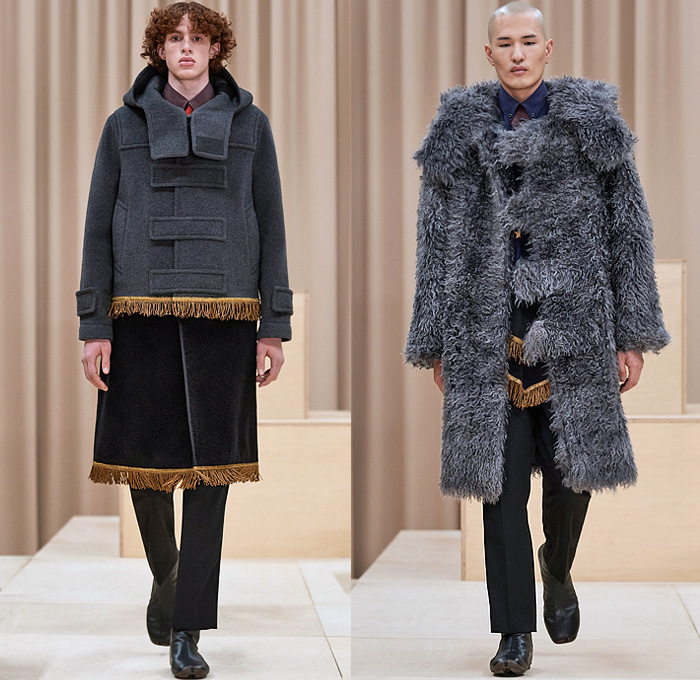 Burberry 2021-2022 Fall Autumn Winter Mens Runway Looks - London Fashion Week Mens Collections UK - Riccardo Tisci - Escapes - Trench Duffle Coat Parka Hoodie Fur Varsity Jacket 8-Point Star Fringes Gold Trims Patchwork Knit Cap Beanie Chevron Stripes Flaps Marching Band Sweater V-Neck Shorts Cap Sleeve Vest Manskirt Kilt Wood Pattern Mandress Shirtdress Accordion Pleats Arm Warmers Quilted Logo Check Bedazzled Gems Jewels Boots