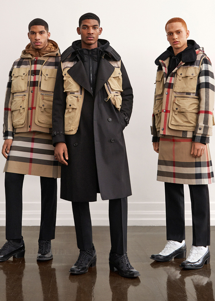 Burberry 2021 Pre-Fall Autumn Mens Lookbook Presentation - Outdoors Mesh Cargo Utility Pockets Vest Quilted Puffer Jacket Trench Coat Parka Anorak Neck Tie Racing Check Hoodie Sweatshirt Cuffs Onesie Overalls Jumpsuit Flowers Floral Jogger Sweatpants Abstract Cow Spots Print Digital Camouflage Accordion Pleats Manskirt Kilt Fanny Pack Pouch Belt Bum Bag Horn Cap Hiking Shoes Furry Sandals Heeled Trainers