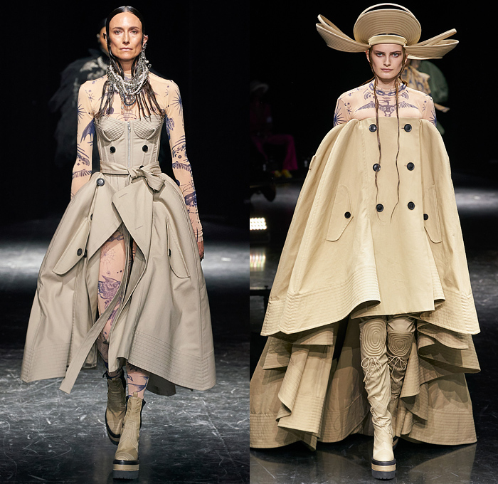 Jean Paul Gaultier 2021-2022 Fall Autumn Winter Womens Runway Looks - Haute Couture High Fashion - Enfants Terribles - Sacai Chitose Abe Collaboration - Chapkas Hat Corset Fur Satin Tulle Deconstructed Hybrid Tattoo Jewellery Denim Jeans Knit Patchwork Cape Stripes Sweater Plaid Check Vest Pinstripe Knee Pads Blazer Flare Safety Pins Metal Studs Shirtdress Conical Bra Trench Dress Strapless Marching Band Motorcycle Biker Bomber Jacket Quilted Puffer Dress Gown Fringes Jogging Suit Boots