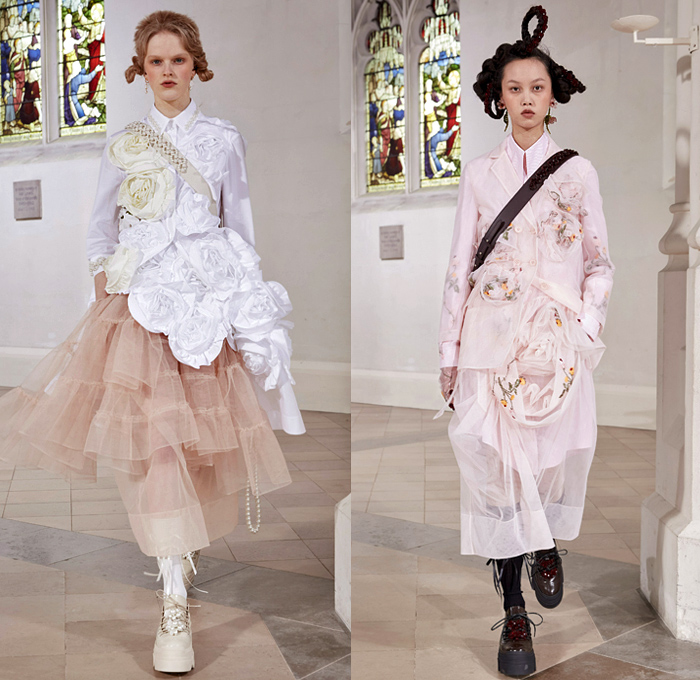 Simone Rocha 2021-2022 Fall Autumn Winter Womens Runway Catwalk Looks - London Fashion Week Collections UK - Fragile Rebel 3D Satin Roses Flowers Floral Trompe L'oeil Edwardian Balloon Sleeves Poufy Puff Shoulders Motorcycle Biker Jacket Tiered Voluminous Ruffles Lace Embroidery Sheer Tulle Pink Black Leather Bedazzled Pearls Crystals Gemstones Harness Brocade Babydoll Pinafore Dress Coat Blazer Blouse Patchwork Pleats Cardigan Tights Leggings Ties Shorts Platform Sneakers Handbag