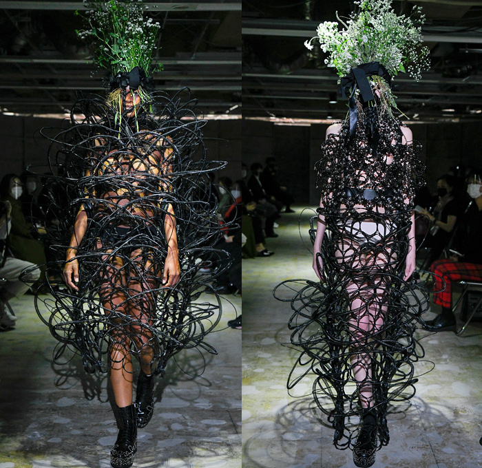 Noir Kei Ninomiya 2021 Spring Summer Womens Runway Catwalk Looks - Rakuten Fashion Week Tokyo Japan - Trompe L'oeil Gothic Sculptural Wires Loops Coils Cage Pearls PVC Chains Tube Polyester Fabrications Bows Ribbons Satin Leather Sheer Tulle Tutu Skirt Tiered Ruffles Frills Knit Weave Mesh Fishnet Braid Plastic Beads Bedazzled Gems Crystals Jewels Spikes Hoodie Voluminous Dress Gown Pink Black Military Jacket Church's Shannon Derby Shoes Floral Flowers Headwear