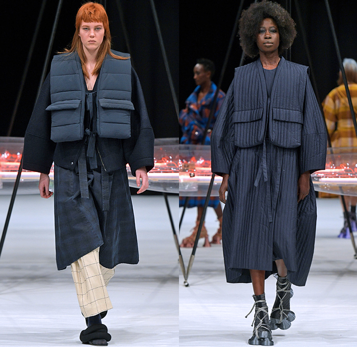 Henrik Vibskov 2022-2023 Fall Autumn Winter Womens Runway Looks - Copenhagen Fashion Week CPHFW Denmark - Biblioteca of Micro Selves - Hoodie Outerwear Coat Parka Jacket Quilted Puffer Vest Gilet Check Plaid Grid Lattice Windowpane Layers Crop Top Midriff Corduroy Fleece Wool Geometric Knit Sweater Spiky Pockets Pantsuit  Blazer Stripes Dress Twist Platelets Pleats Draped Hi-Tops Sneakers Gladiator Suction Cups Satchel