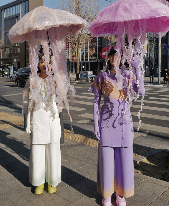 PH5 2022-2023 Fall Autumn Winter Womens Lookbook Presentation - New York Fashion Week NYFW - Stay on Earth - Space Suit Bubble Helmet Bug Antennae Inflatable Jellyfish Umbrellas Fur Knit Sweater Weave Geometric Waves Asymmetrical Miniskirt Curved Hem Gloves Quilted Jacket Puff Sleeves Leggings Tights Poncho Cloak Sheer Dress Ruffles Peplum Blouse Tracksuit Onesie Coveralls Jumpsuit Crop Top Midriff Ombré Hotpants Noodle Strap Wide Leg Palazzo Pants Opera Gloves Toys Socks Boots