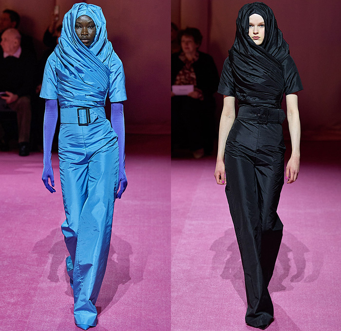 Richard Quinn 2022-2023 Fall Autumn Winter Womens Runway Catwalk Looks - London Fashion Week Collections UK - Puff Ball Poufy Shoulders Silk Satin Flowers Floral Latex Ribbons Bows Drawstring Hood Burqa Wrap Pleats Ruffles Frills Tiered Asymmetrical Embroidery Sequins Scales Paillettes Cape Coat Oversized Houndstooth Polka Dots Feathers Strapless Maxi Dress Gown Cinch Velvet Quilted Leggings Tights Peplum Wide Leg Draped Train Gloves Wide Brim Hat Peephole Round Suitcase Luggage Bag