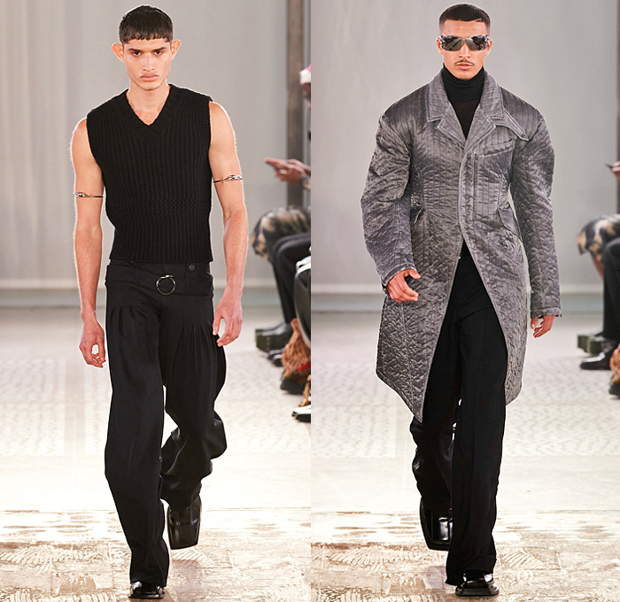 Trussardi 2022-2023 Fall Autumn Winter Mens Runway Looks - Milano Moda Donna Collezione Milan Fashion Week Italy - Chunky Knit Crochet Sweater Turtleneck Utility Pockets Cargo Pants Flare Denim Jeans Vest Pleats Quilted Puffer Outerwear Coat Oversized Hoodie Wide Lapel Suit Blazer Jacket Fur Shearling Velvet Zipper Wide Leg Baggy Loose Handbag