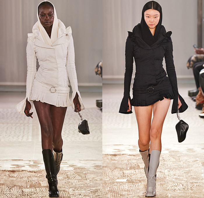 Trussardi 2022-2023 Fall Autumn Winter Womens Runway Looks - Milano Moda Donna Collezione Milan Fashion Week Italy - Strapless Open Shoulders Crop Top Midriff Quilted Puffer Jacket Hoodie Oversized Outerwear Coat Fur Shearling Velvet Zipper Corset Shapewear Crinoline Poodle Skirt High Slit Knit Denim Jeans Miniskirt Wide Leg Baggy Loose Pleats Utility Pockets Cargo Pants Thigh High Boots Handbag Purse